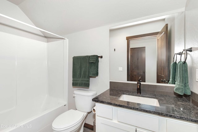 full bathroom with washtub / shower combination, vanity, toilet, and lofted ceiling