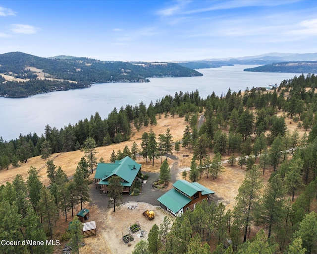 drone / aerial view featuring a water and mountain view