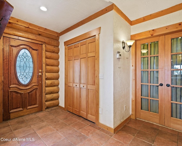 foyer entrance with french doors and log walls