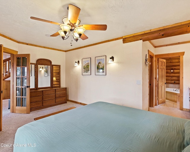 bedroom featuring crown molding, light carpet, and a textured ceiling