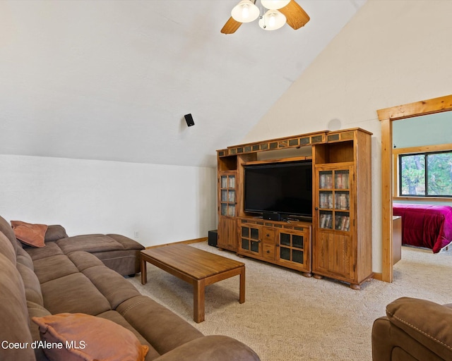 carpeted living room featuring lofted ceiling and ceiling fan