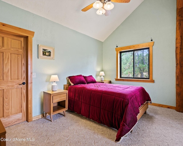 bedroom featuring lofted ceiling, light colored carpet, and ceiling fan