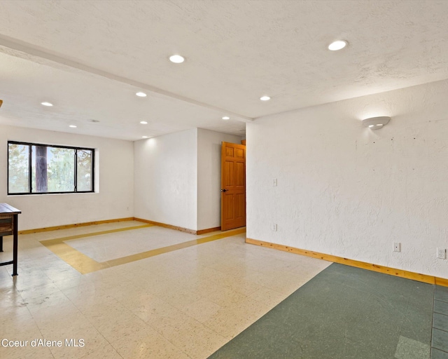 empty room with a textured ceiling