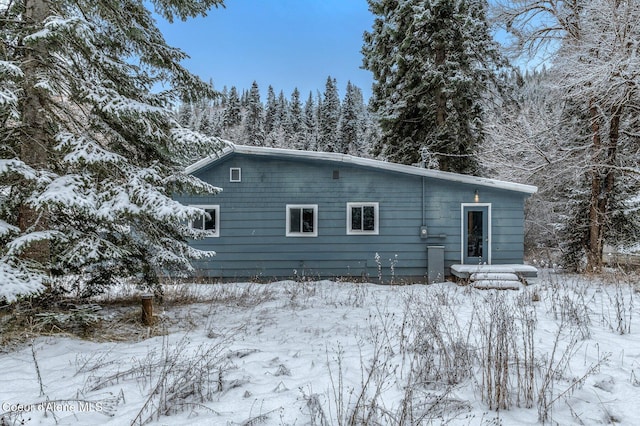 view of snow covered house