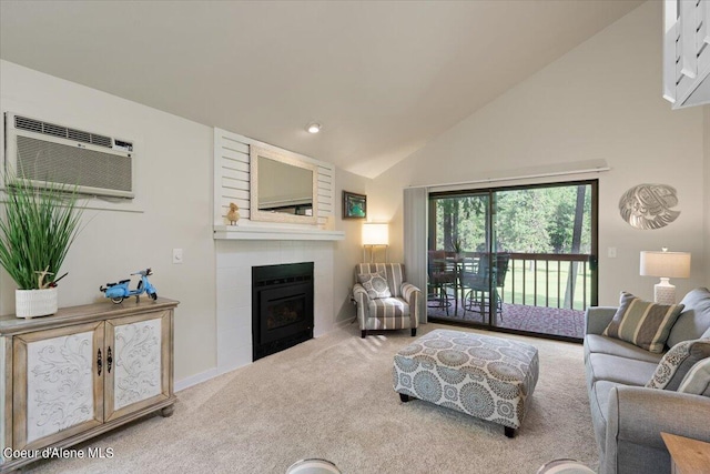 living room featuring high vaulted ceiling, a large fireplace, a wall mounted AC, and carpet flooring