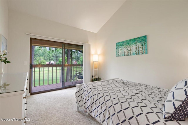 carpeted bedroom with access to exterior and high vaulted ceiling