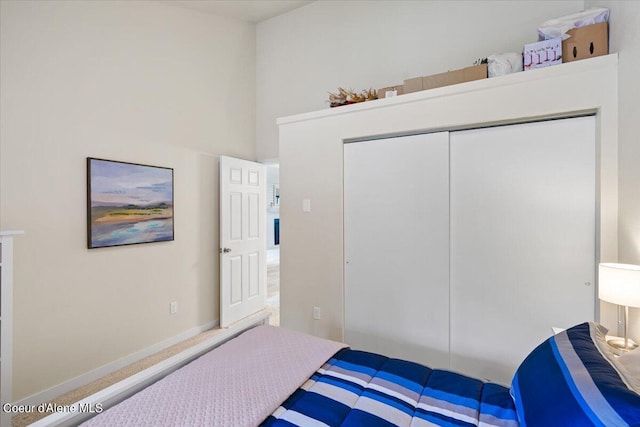 bedroom with a closet and a high ceiling