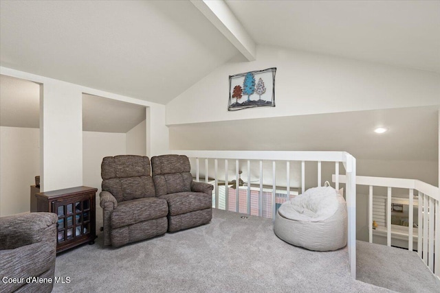 living area with lofted ceiling with beams and carpet