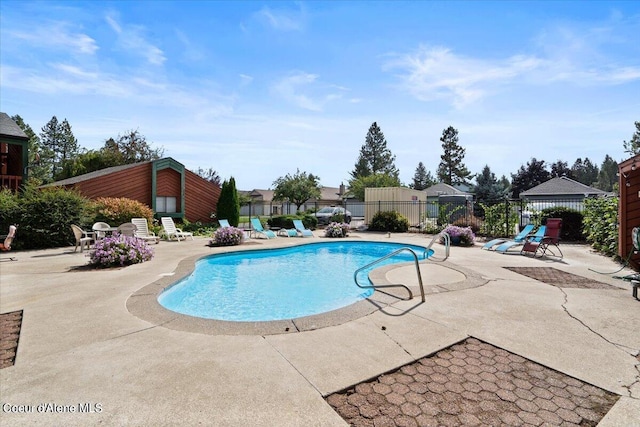 view of swimming pool featuring a patio