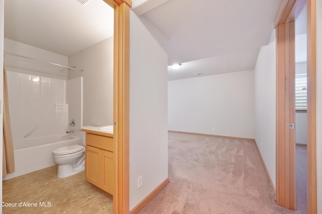 full bathroom featuring shower / tub combination, vanity, tile patterned flooring, and toilet