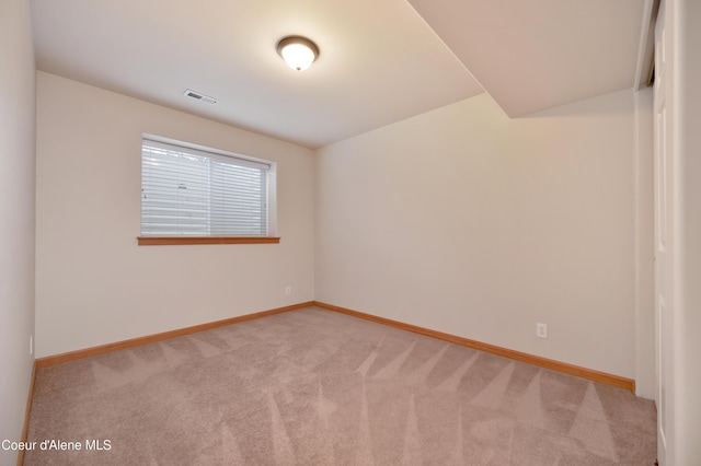 unfurnished room with light carpet