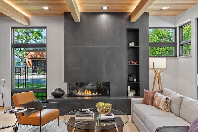 living room featuring beam ceiling and wooden ceiling