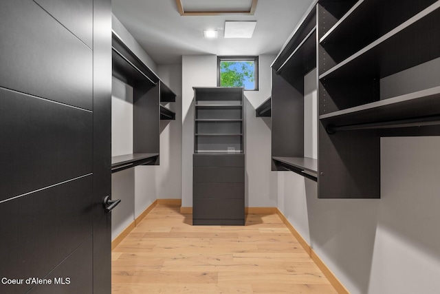 walk in closet featuring light hardwood / wood-style floors