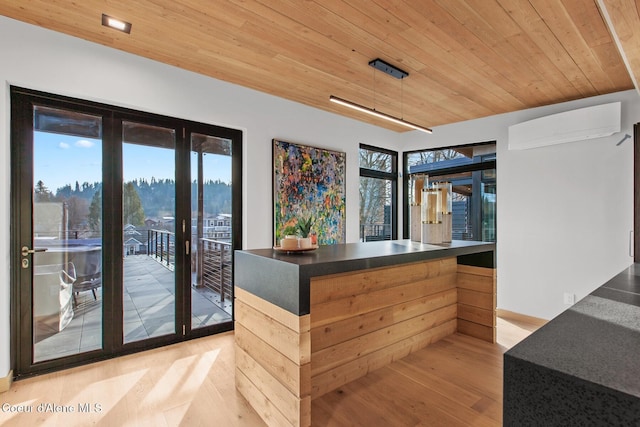 bar with a mountain view, an AC wall unit, wooden ceiling, and light hardwood / wood-style floors