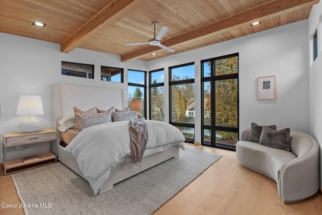 bedroom featuring beam ceiling, wood ceiling, ceiling fan, and light wood-type flooring