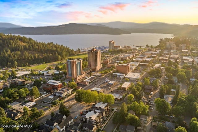 aerial view at dusk with a water and mountain view