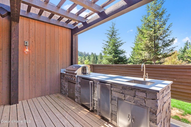 2763 E Lower Pasture Rd, Harrison, ID 83833 - wooden deck featuring an outdoor kitchen, a grill, and sink