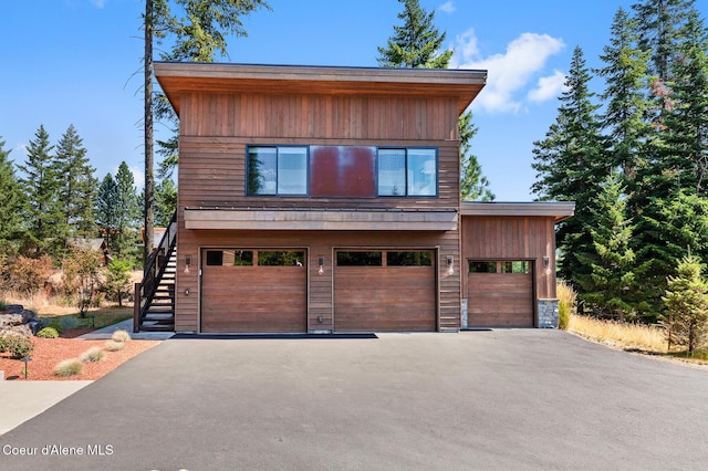 2763 E Lower Pasture Rd, Harrison, ID 83833 - contemporary house featuring a garage