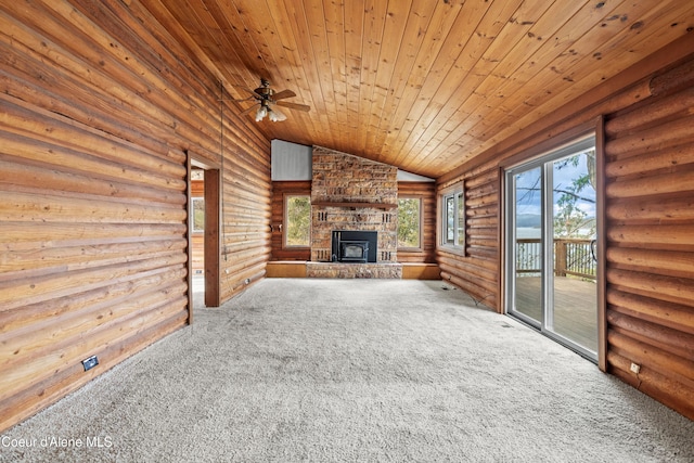 unfurnished living room with lofted ceiling, wooden ceiling, carpet flooring, ceiling fan, and an outdoor stone fireplace