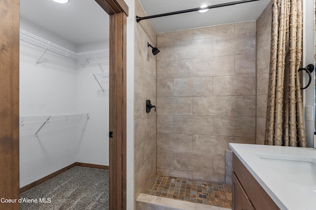 bathroom with a shower with curtain and vanity