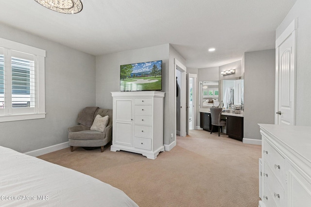 carpeted bedroom featuring built in desk and multiple windows