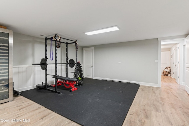 workout room with hardwood / wood-style flooring