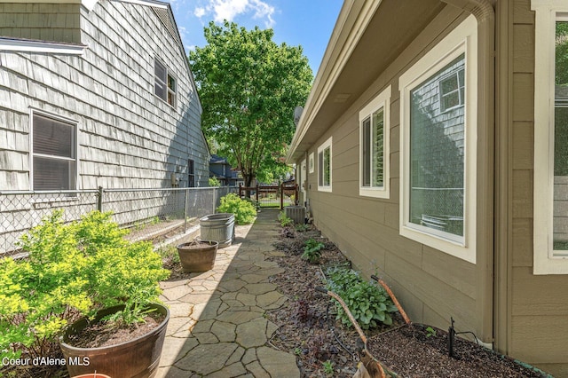 view of property exterior with central AC