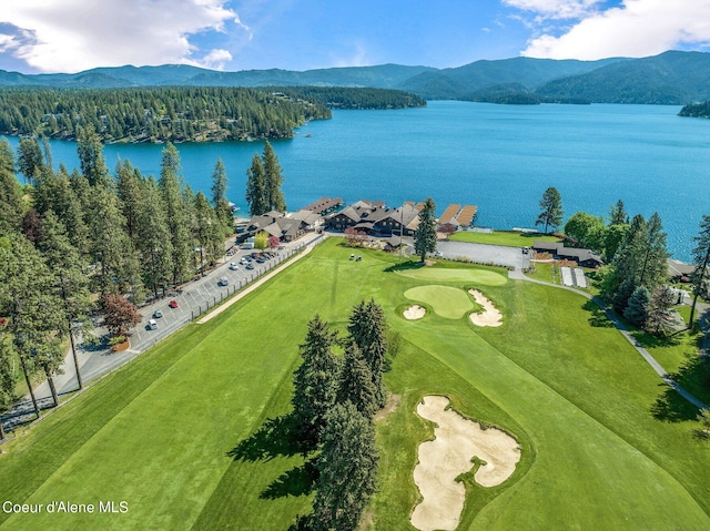 drone / aerial view featuring a water and mountain view