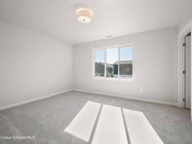 empty room featuring light colored carpet