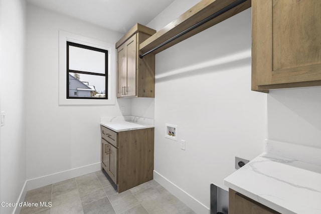 washroom featuring cabinets, electric dryer hookup, and hookup for a washing machine