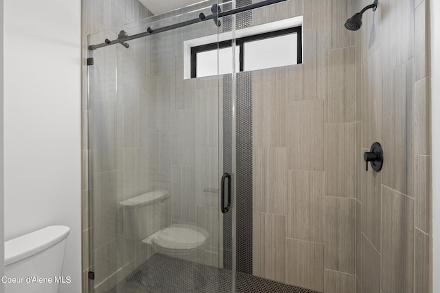 bathroom with toilet and walk in shower