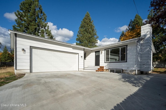 ranch-style home with a garage