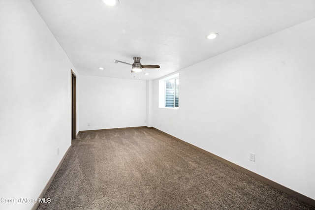 unfurnished room with ceiling fan and carpet flooring