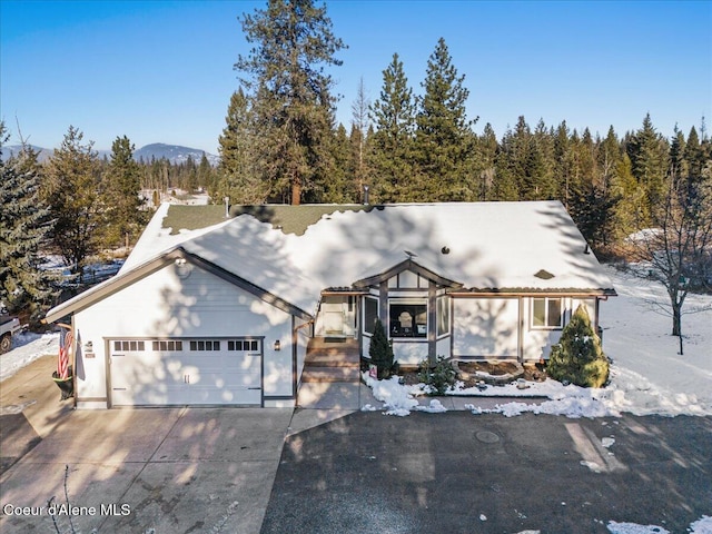 view of front of house with a garage and a mountain view