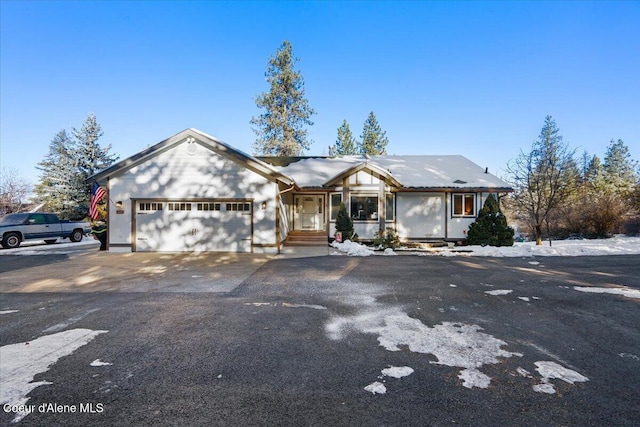 ranch-style home featuring a garage