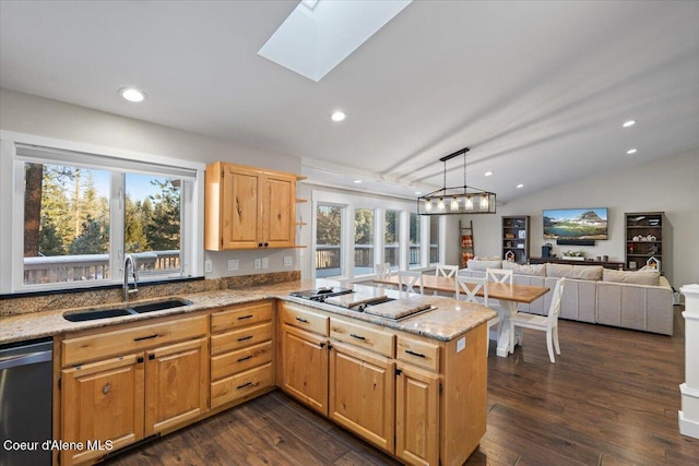 kitchen with sink, black appliances, kitchen peninsula, and a healthy amount of sunlight