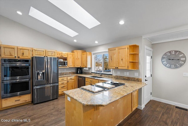 kitchen featuring light brown cabinetry, black appliances, sink, light stone counters, and kitchen peninsula