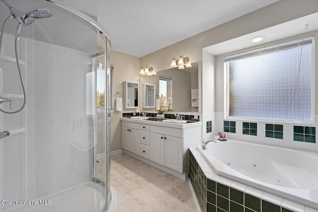 bathroom featuring vanity and shower with separate bathtub