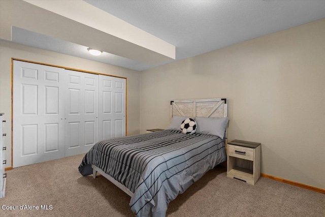 bedroom with carpet floors and a closet