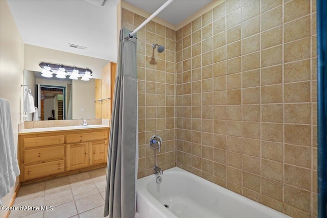 bathroom featuring tile patterned flooring, vanity, and shower / bathtub combination with curtain