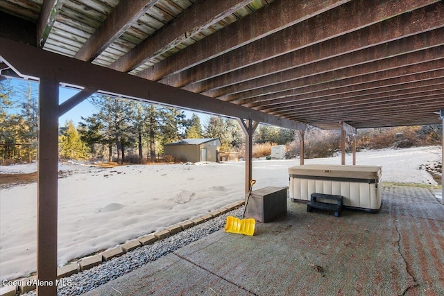 snow covered patio with a jacuzzi