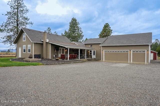 view of front of house featuring a garage and covered porch