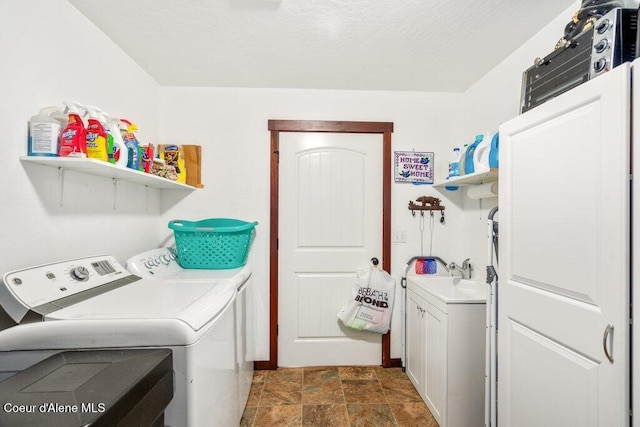 laundry area with cabinets and independent washer and dryer