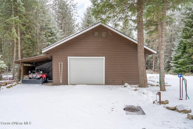 view of snow covered garage