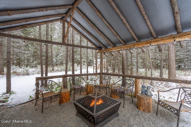 unfurnished sunroom featuring lofted ceiling