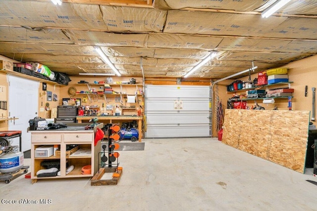 garage with a workshop area