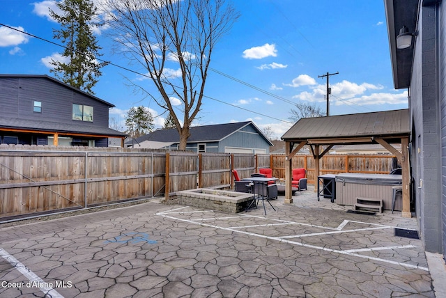1715 Sherman Ave, Coeur Dalene, ID 83814 - view of patio featuring a gazebo and a hot tub