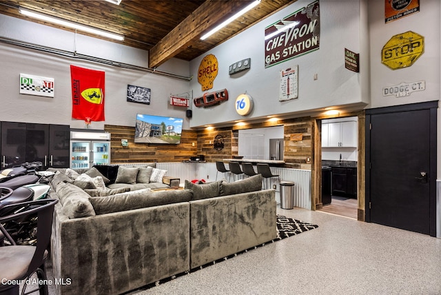 1715 Sherman Ave, Coeur Dalene, ID 83814 - living room featuring beamed ceiling, wooden ceiling, and a high ceiling