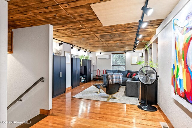 1715 Sherman Ave, Coeur Dalene, ID 83814 - living room with hardwood / wood-style flooring, an AC wall unit, track lighting, and wooden ceiling