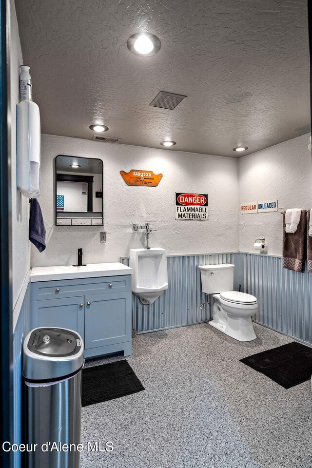 1715 Sherman Ave, Coeur Dalene, ID 83814 - bathroom featuring vanity, a textured ceiling, and toilet